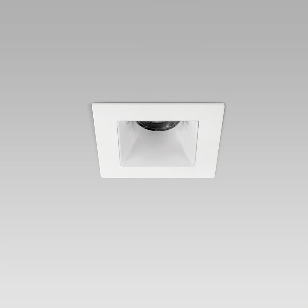 Squared recessed ceiling downlight for interior lighting with protruding frame and white optic