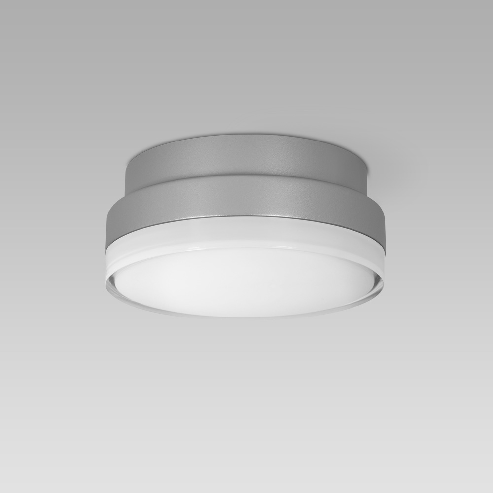 Compact-size and resistant ceiling or wall-mounted luminaire for indoor and outdoor lighting